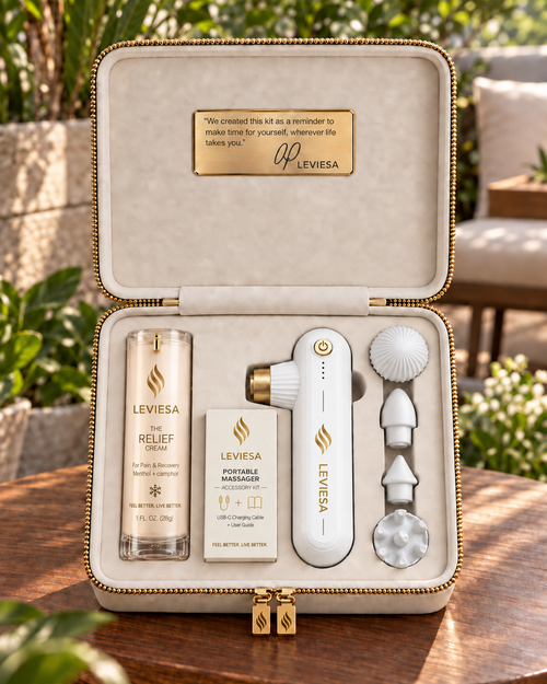 The LEVIESA travel case open, showing The Relief Cream, the portable massager and its four attachment heads